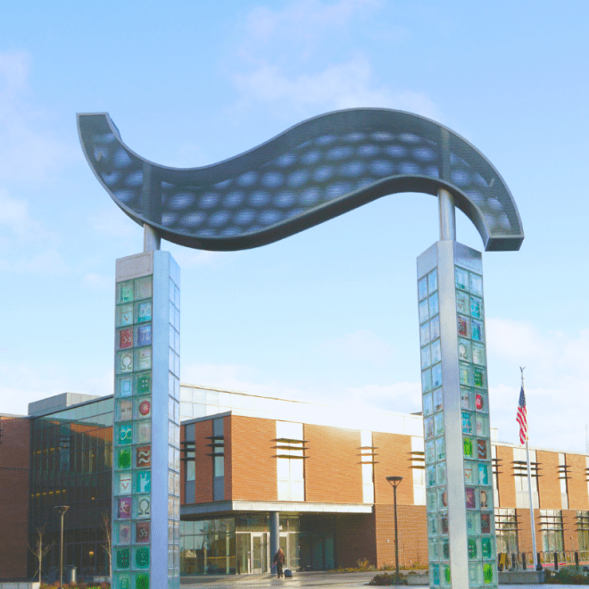 Image of Pi Square sculpture with the Olympic College Logo
