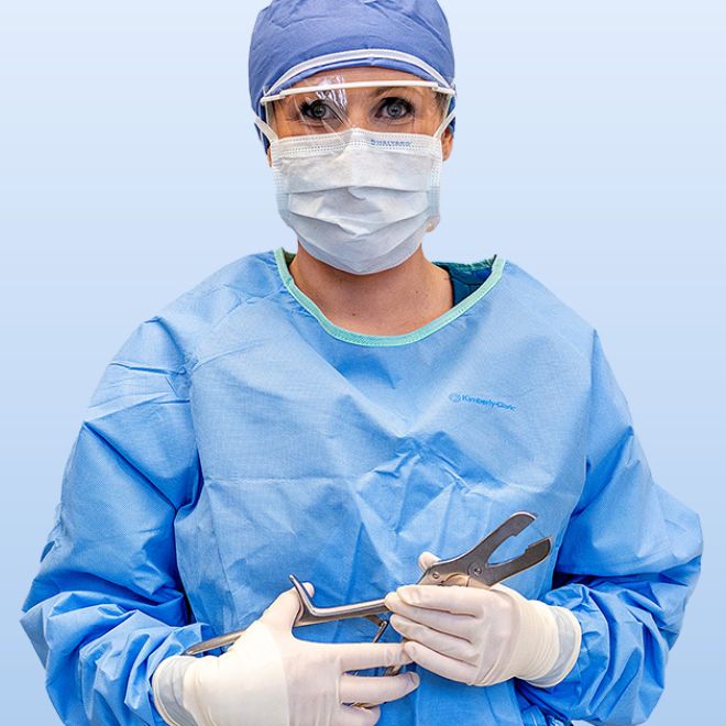 Surgical Technician holding tools for surgery