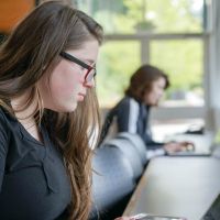 Students studying on laptops