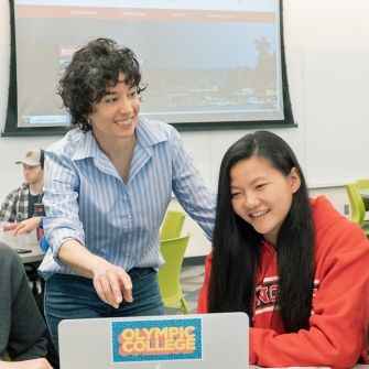 Active Learning Classroom teacher with students and laptop