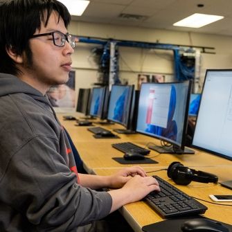 Student working at a computer lab work station