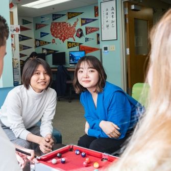 Students playing pocket pool.