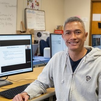 Male student at computer. 