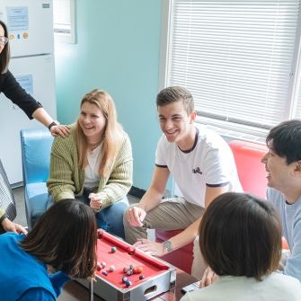 Students with staff smiling