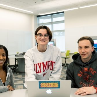 Students in a classroom with laptop