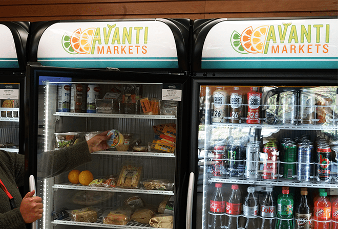 Person grabbing food from cooler. 