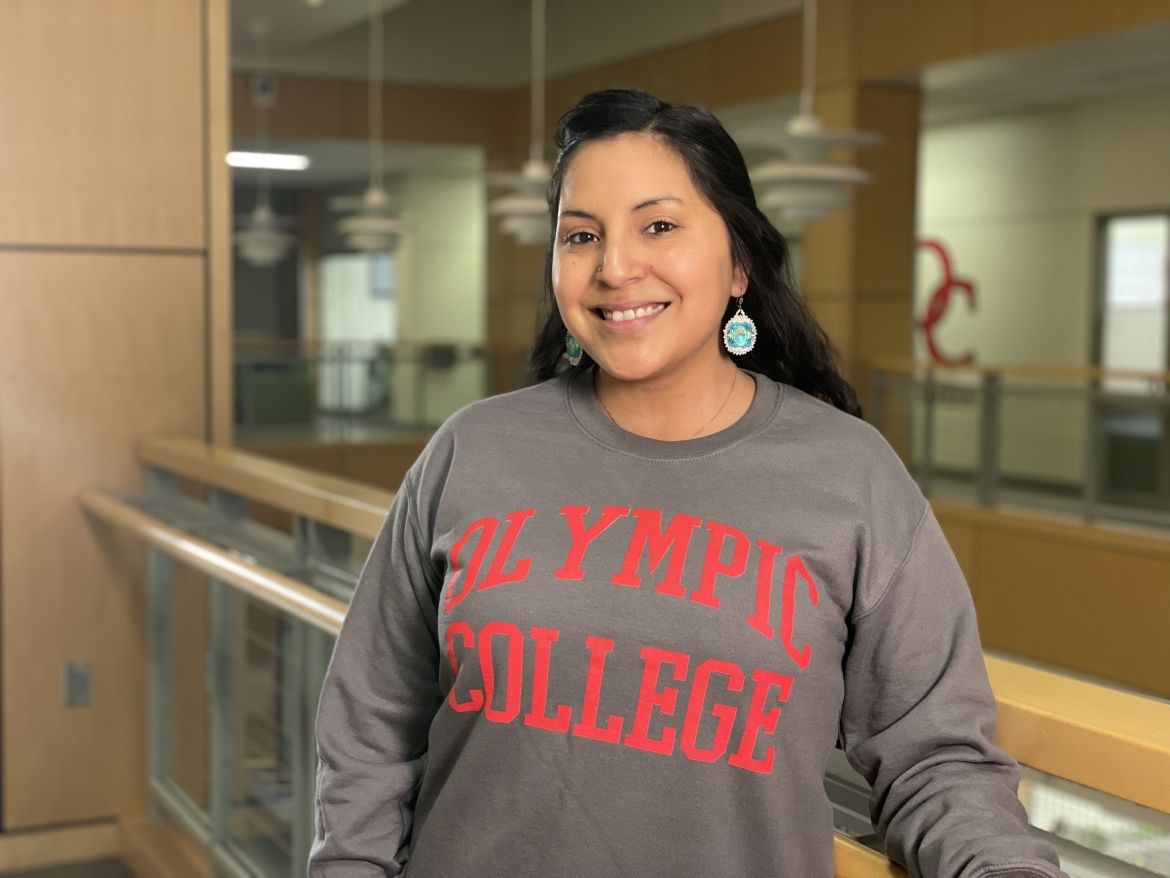 Smiling student in gray Olympic College sweatshirt, in Bldg. 4