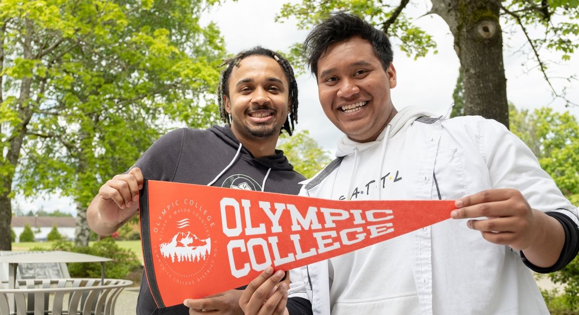 Two students with pennant.