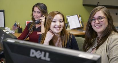 Three smiling student employees