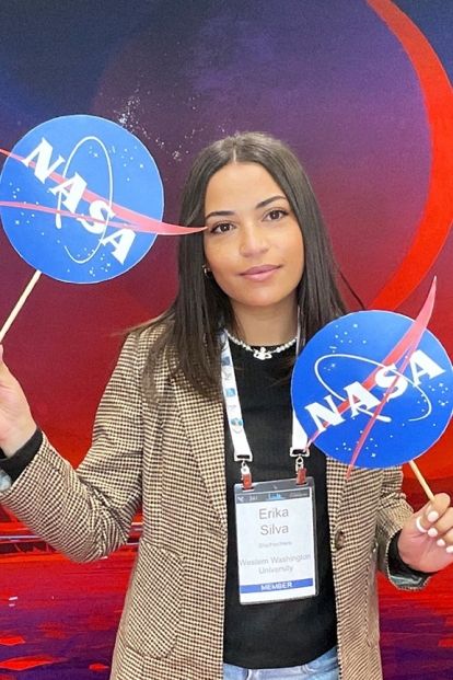 Erika Silva holding NASA signs