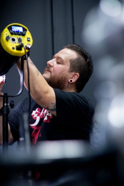 Film student with lighting equipment