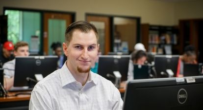 Male Student in computer lab.
