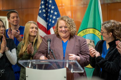 Student Nicole Boyd speaking at podium