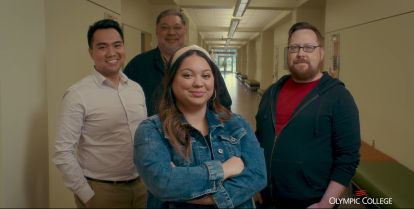 Four leadership students standing in a hallway