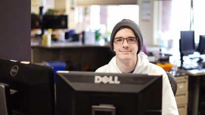 Student worker at computer