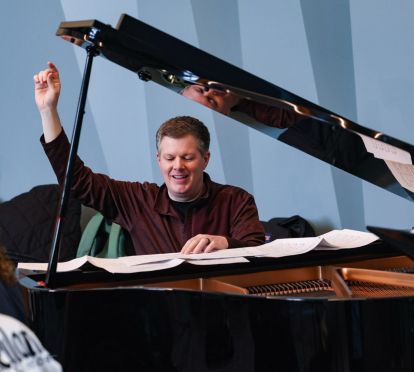 Music faculty playing piano