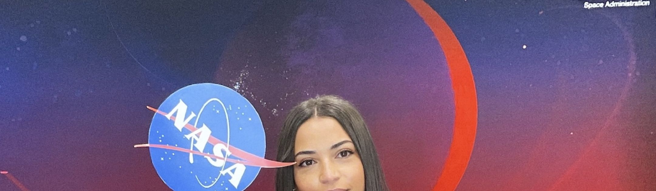 Erika Silva holding NASA signs