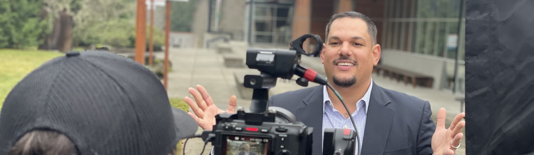 Student outdoors at Poulsbo Campus and posing for camera