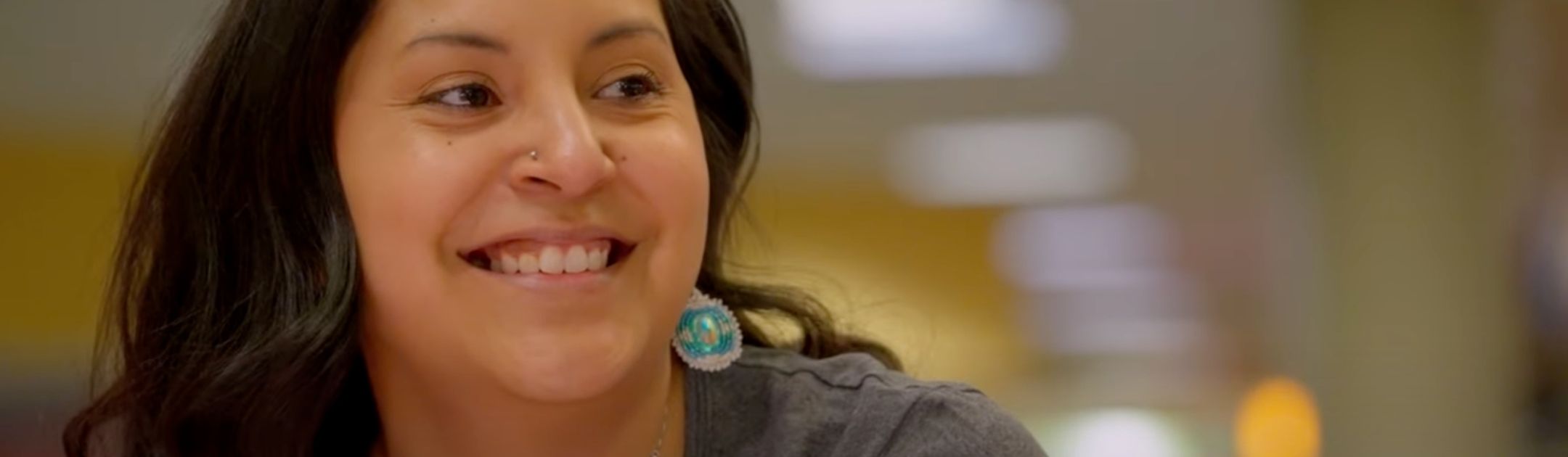 Close-up of student smiling in Bremer Student Center