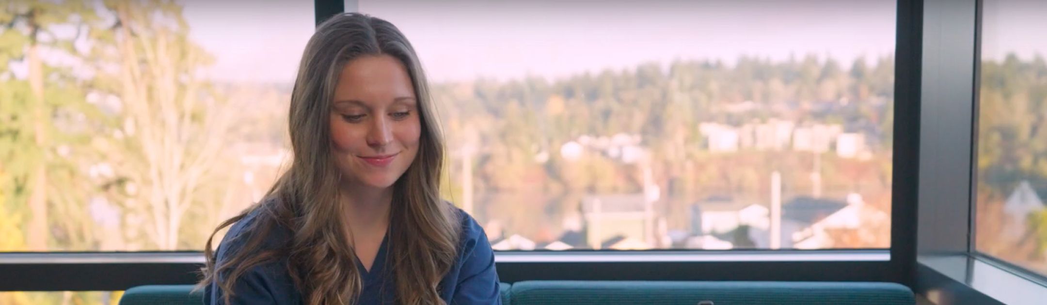 Female student working on laptop.