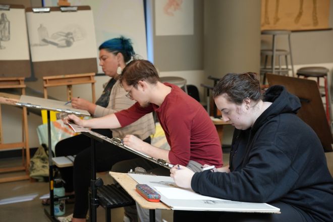 Students in class drawing