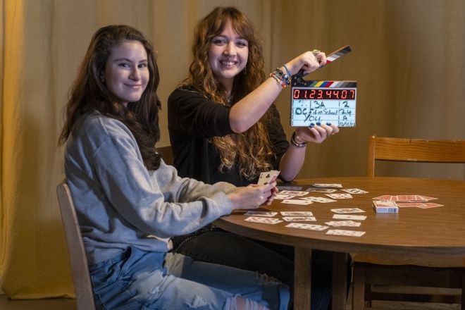 Film students smiling on set