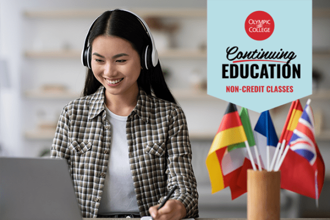 A woman sitting at a computer beside a cup filled with flags of various countries. Text reads, "Olympic College Continuing Education Non-Credit Classes"