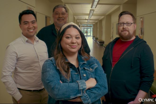 Four leadership students standing in a hallway