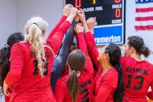 women's sports team celebrating