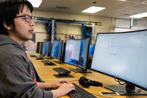 Student working at a computer lab work station