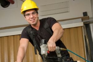 Construction worker with hard hat and glases.