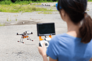 Female operating a drone.