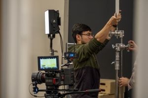 Filmmaking student on set