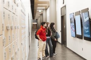 Filmmaking students walking down hallway