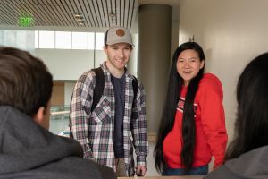 Student at table together.
