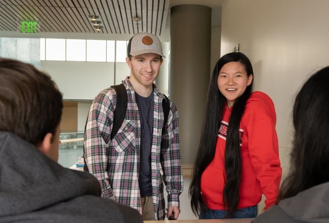 Student at table together.