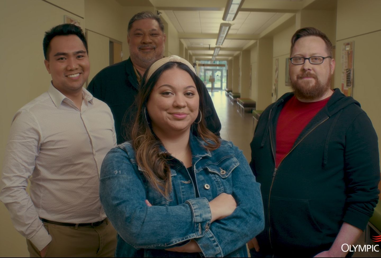 Four leadership students standing in a hallway