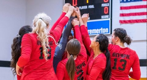 women's sports team celebrating