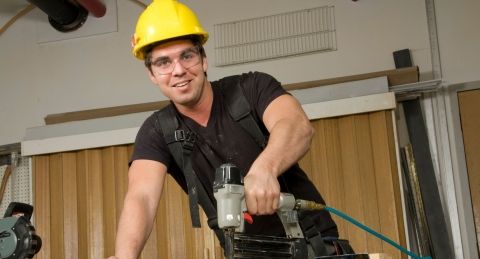Construction worker with hard hat and glases.