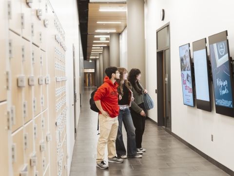 Filmmaking students walking down hallway