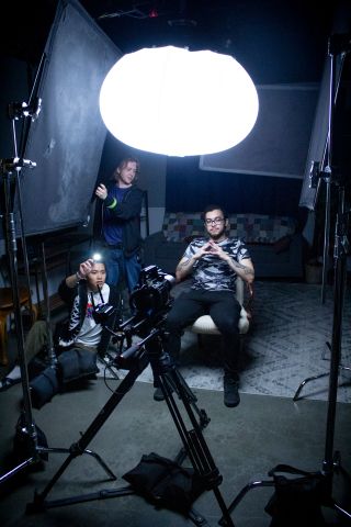 Film students with lighting equipment