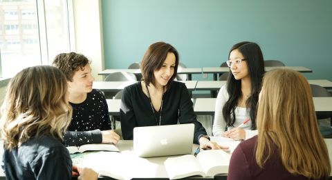 Teacher in classroom.