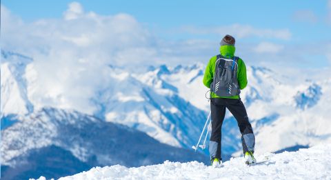 Man on top of mountain.