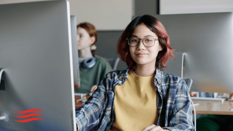 Student at computer.