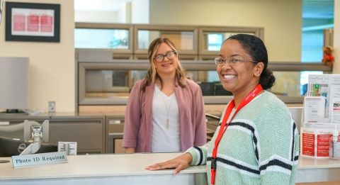 Student-Services-two-females.jpg Two female students at enrollment counter.