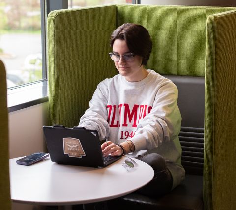 Student working on campus on a tablet