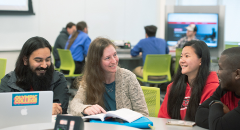 Student with teacher in classroom.