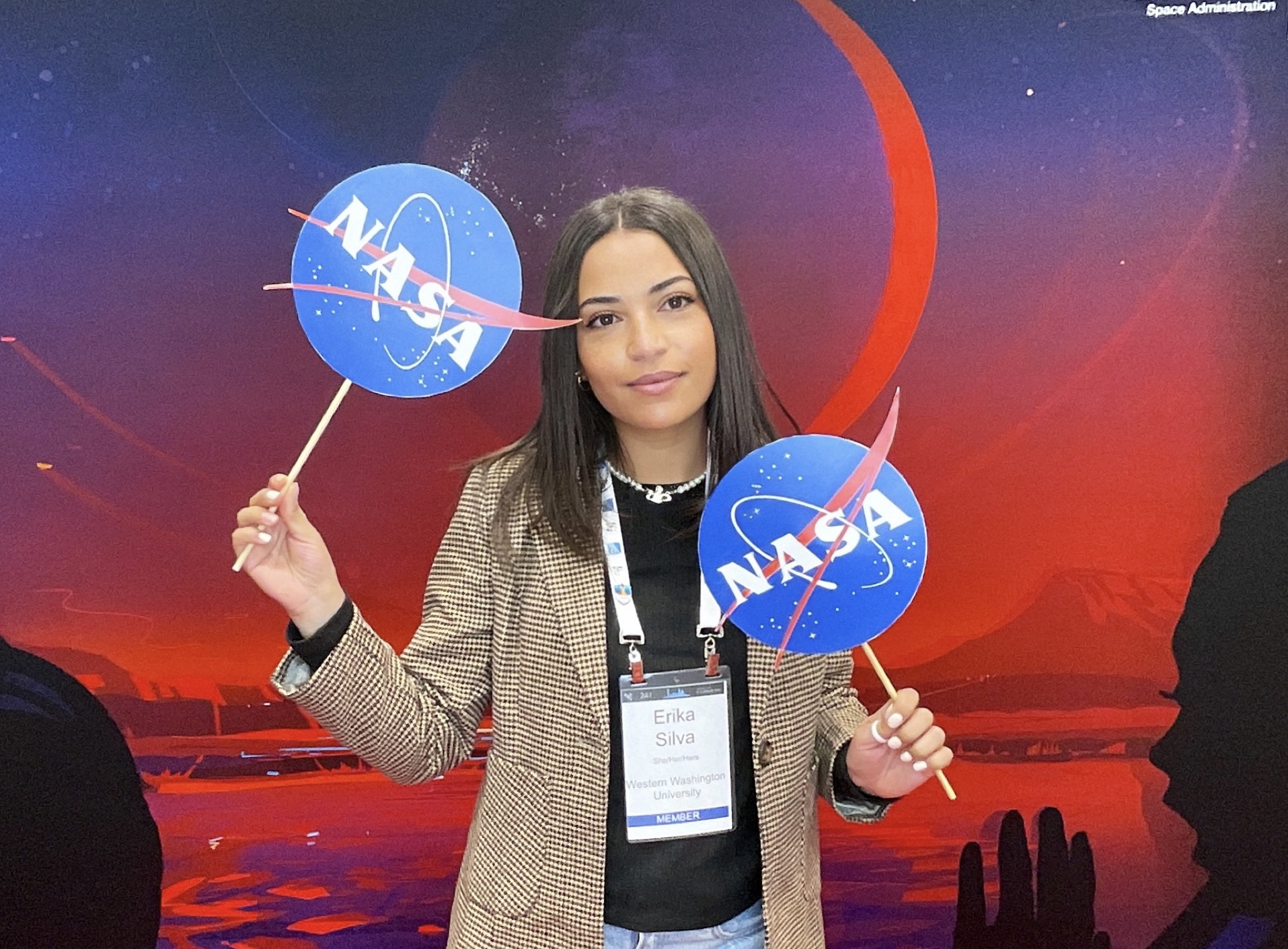 Erika Silva holding NASA signs