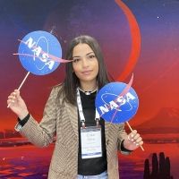 Erika Silva holding NASA signs