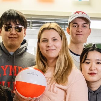 Female student with beach ball.